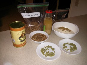 Brew Ingredients including Amber LME, light DME and sugar, 40g of Cascade hops, two types of crystal malt and harvested yeast